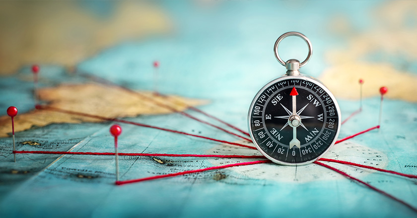 Bild von einer Weltkarte und einem Kompass